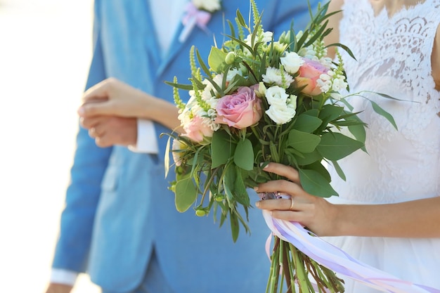 Happy wedding couple on river background