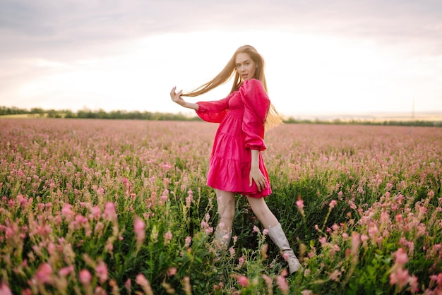 Happy woman in the blooming field Nature vacation relax and lifestyle Summer landscape