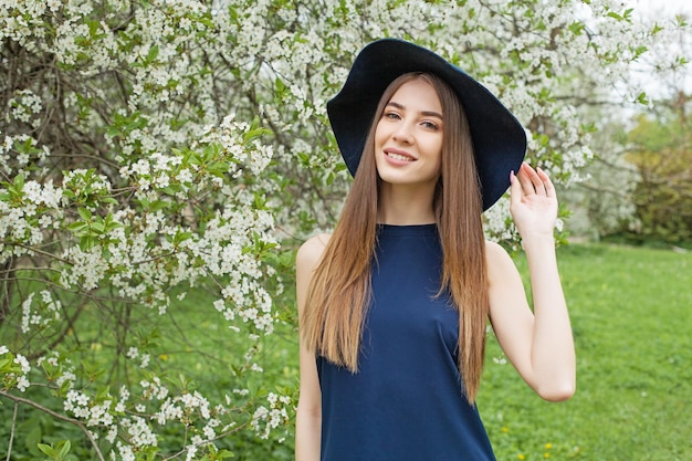 Happy woman in blue dress outdoor