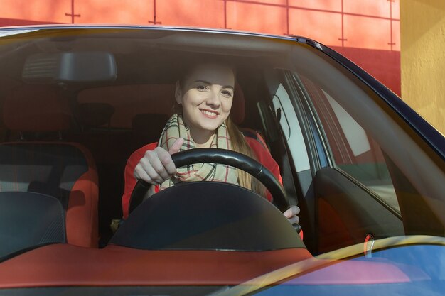 The Happy woman in the car