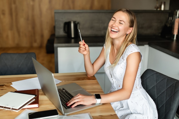 Happy woman at home office