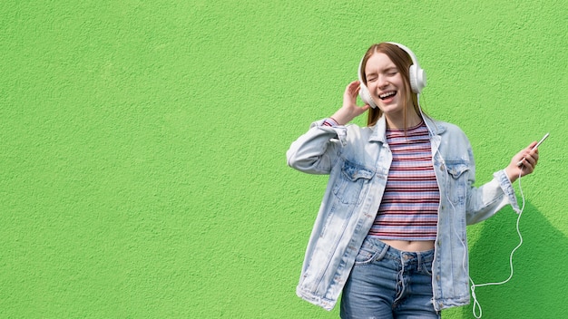 Happy woman listening to music