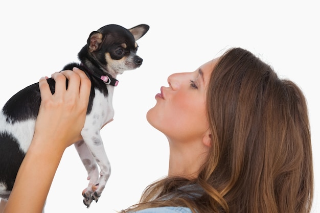 Happy woman looking at her chihuahua