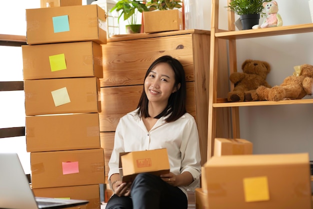 Happy Woman in a room full of boxes