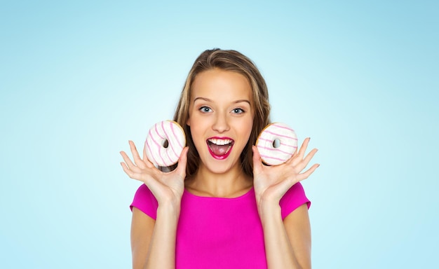 Photo happy woman or teen girl with donuts