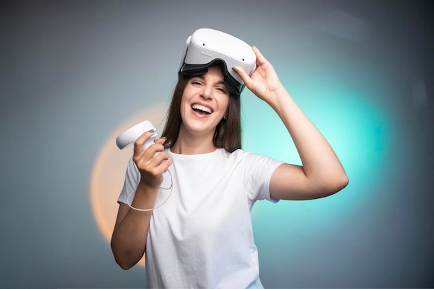 Happy woman using a virtual reality headset isolated on colorful background