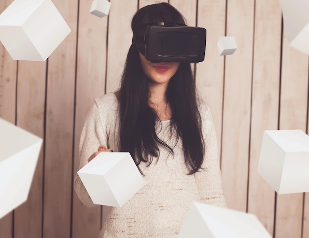 Photo happy woman in vr glasses with 3d objects around