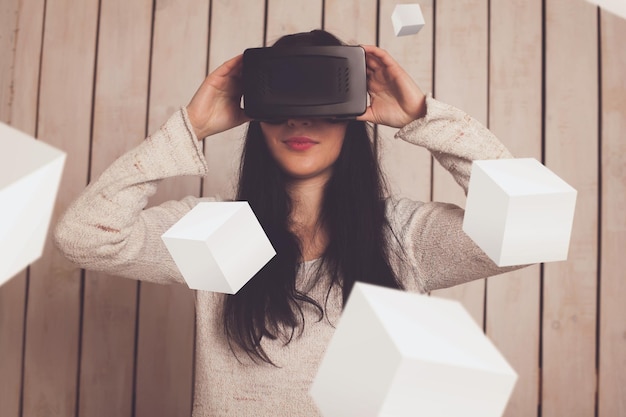 Photo happy woman in vr glasses with 3d objects around