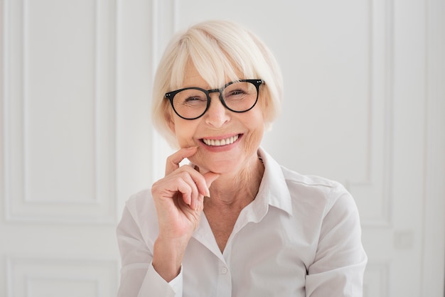 Happy woman with eyeglasses medium shot