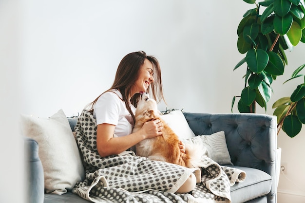 Happy woman with a Pomeranian spitz