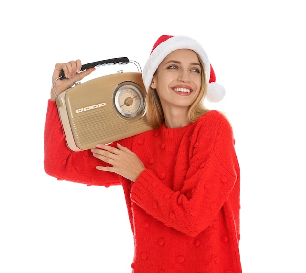 Happy woman with vintage radio on white background Christmas music