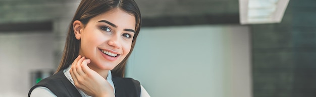 The happy woman working at the desktop