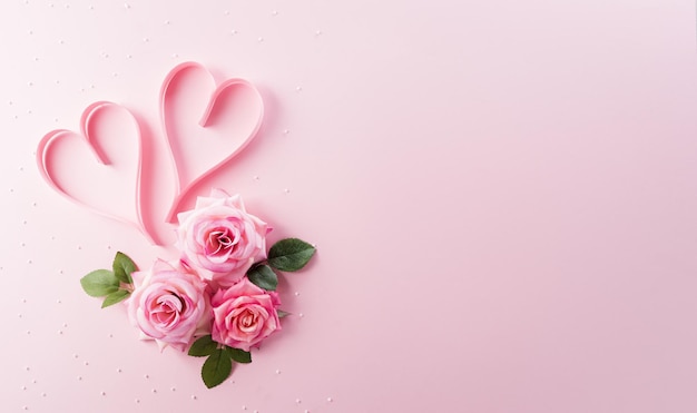 Happy Womens Day decoration concept made from rose flower and heart on pink pastel background