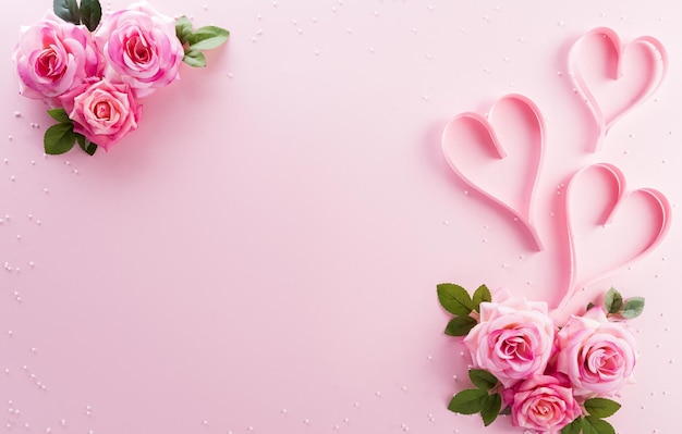 Happy Womens Day decoration concept made from rose flower and pink hearts on pastel background