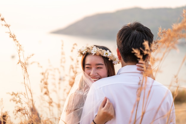 Happy young Asian couple in love having a good time