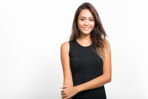 Happy young beautiful Asian woman with brown hair