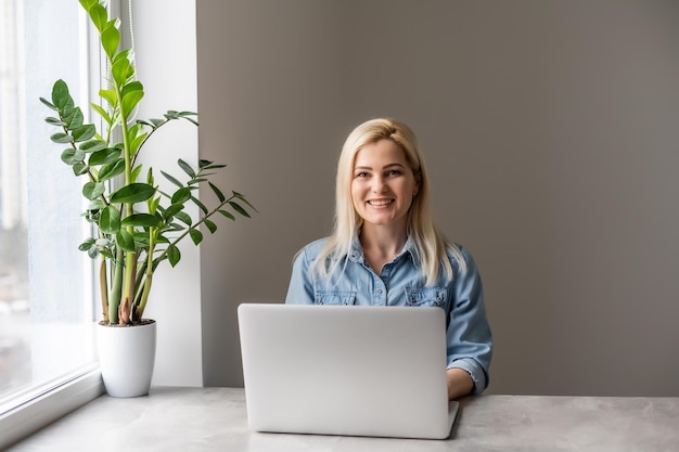 Happy Young Beautiful Woman Using Laptop, Indoors.