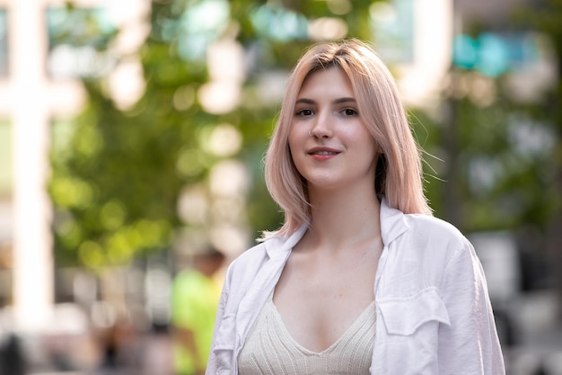 Happy young beautiful woman walking on the street Image of beautiful stylish woman