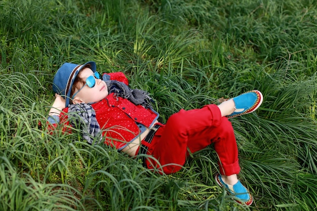 Happy young boy on grass