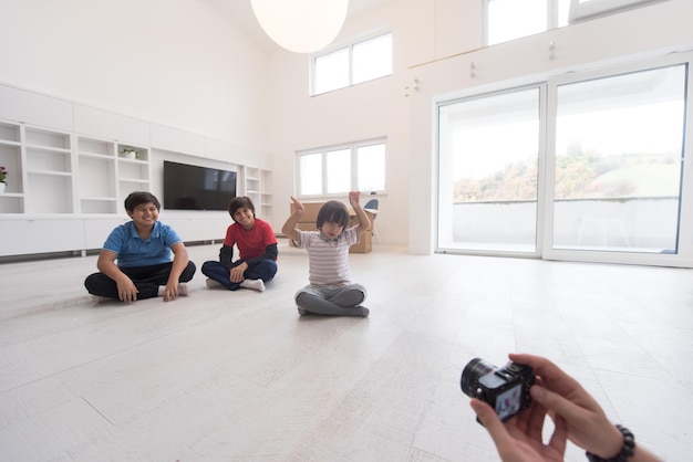 happy young boys having fun on the floor in a new modern home