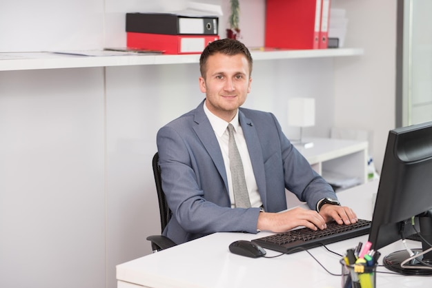 Happy Young Business Man Work In Modern Office On Computer