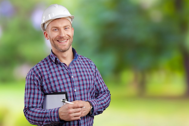 Happy young businessman architect smiling