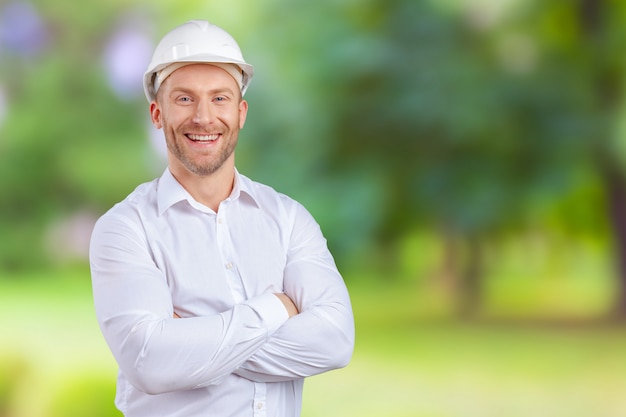 Happy young businessman architect smiling