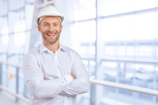 Happy young businessman architect smiling