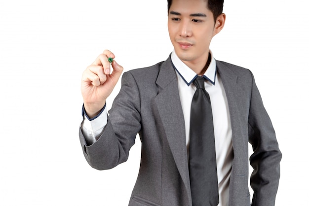 Happy young businessman looking hand and hold laptop in suit, isolated concept