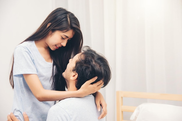 Happy Young Couple on the Bed in Bedroom Romantic Moments