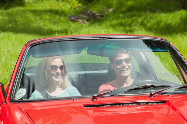 Happy young couple going for a ride together