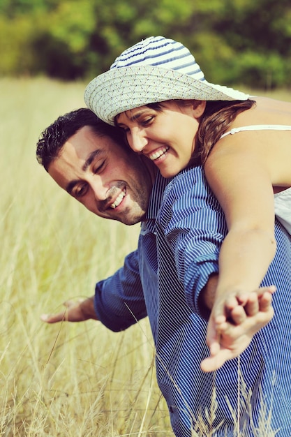 happy young couple have romantic time outdoor while smiling and hug