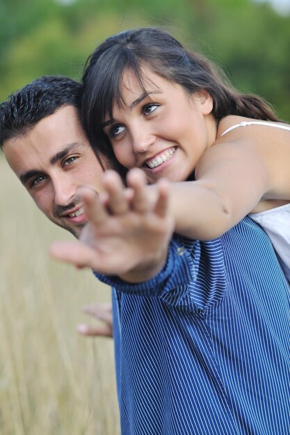 happy young couple have romantic time outdoor while smiling and hug