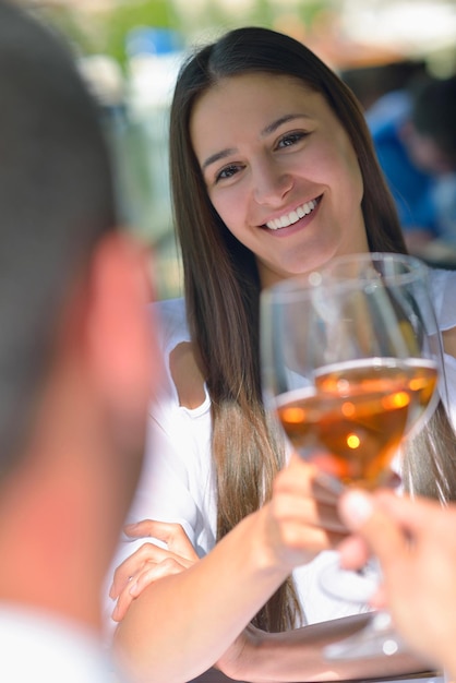 happy young couple having lanch at beautiful restaurant on the beach