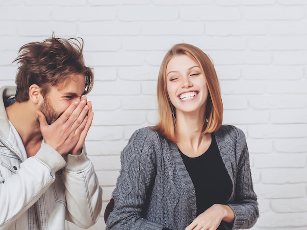 Happy young couple laugh