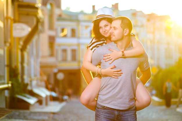 Happy young couple in love posing in the city