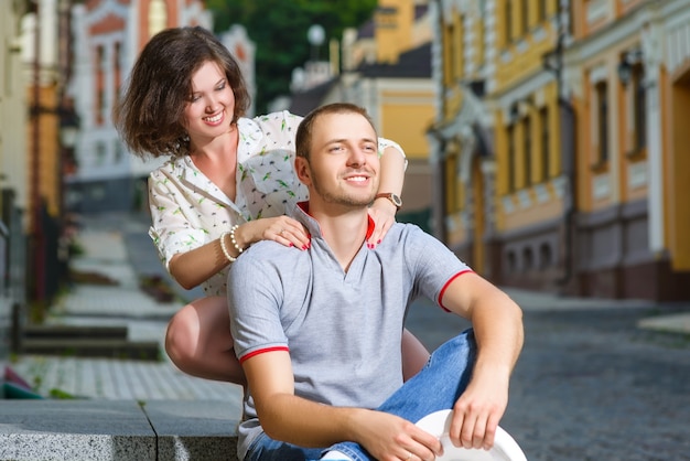 Happy young couple in love posing in the city