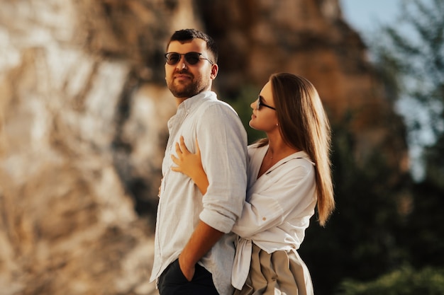 Happy young couple outdoors in the mountain