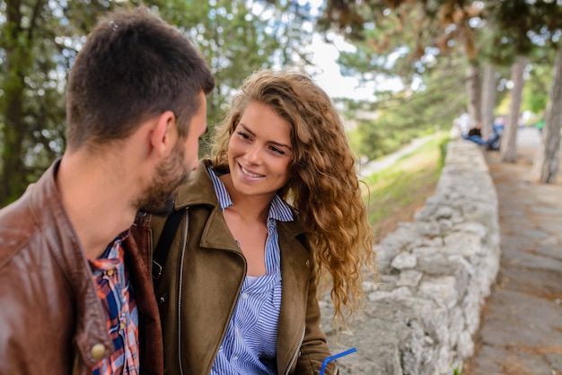 Happy young couple in the public park