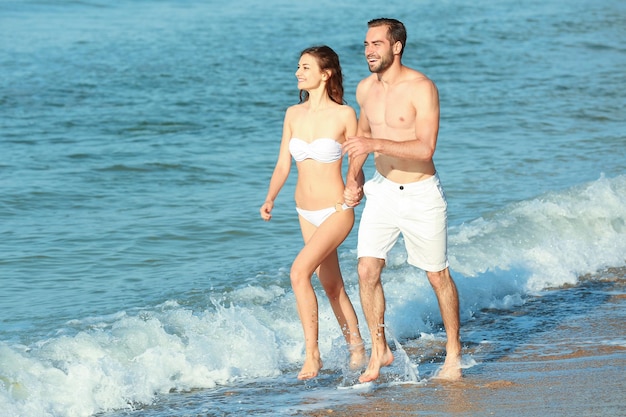 Happy young couple at sea resort