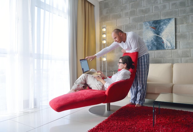 happy young  Couple Using Laptop computer At Home