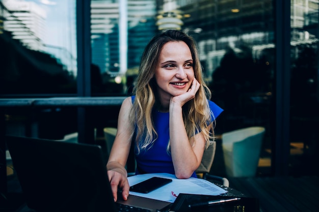 Happy young employee working in office