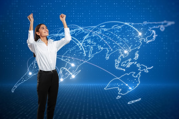 Happy young european businesswoman with abstract glowing map hologram on blue background Digital world network and technology concept