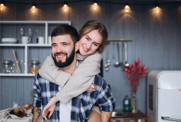 Happy young family in cozy kitchen together