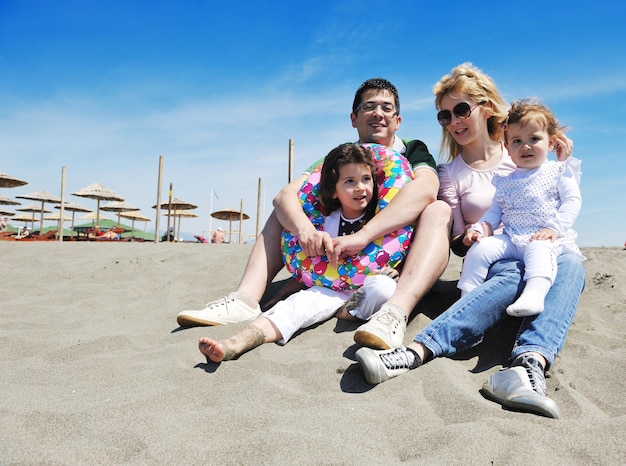 happy young family have fun and live healthy lifestyle on beach