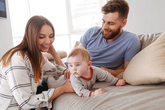 Happy young family. Parents having fun with their little child