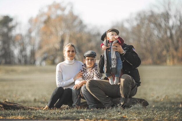 Photo happy young family spending time together outside in green nature candid real family moment