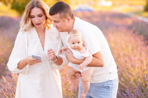 Happy young family summer day outdoor