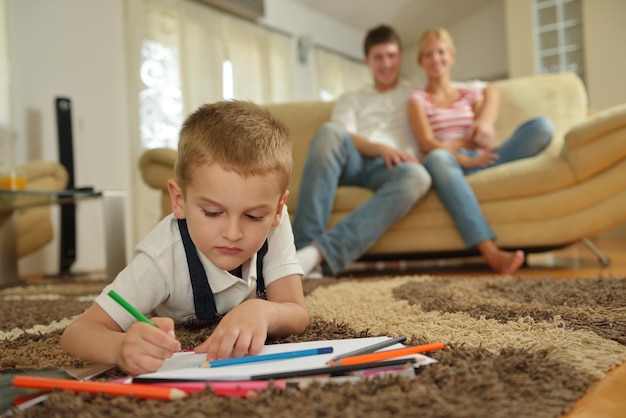 happy young family with kids in bright modern living room have fun and looking big flat lcd tv