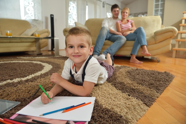 happy young family with kids in bright modern living room have fun and looking big flat lcd tv